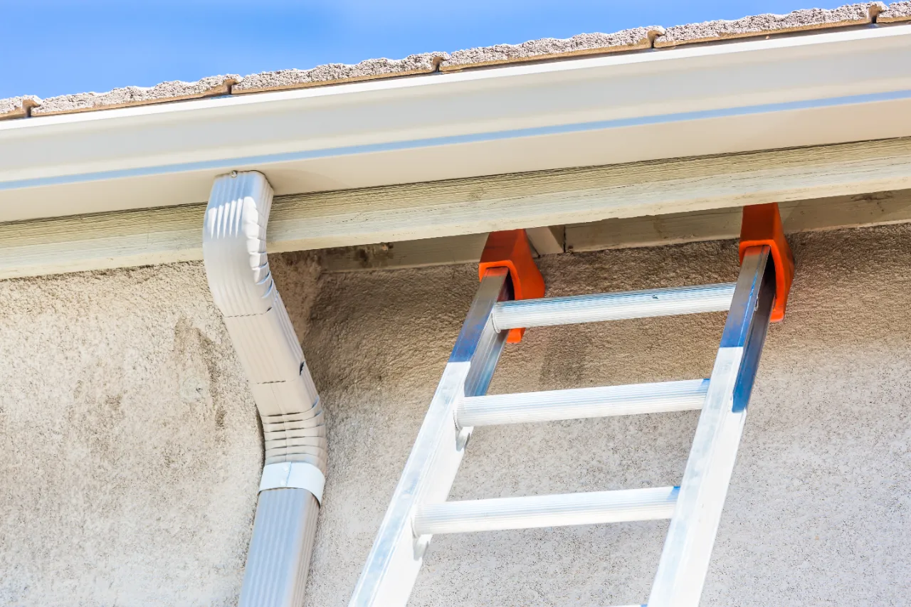 Seamless gutter and downspout system installed on a New York home