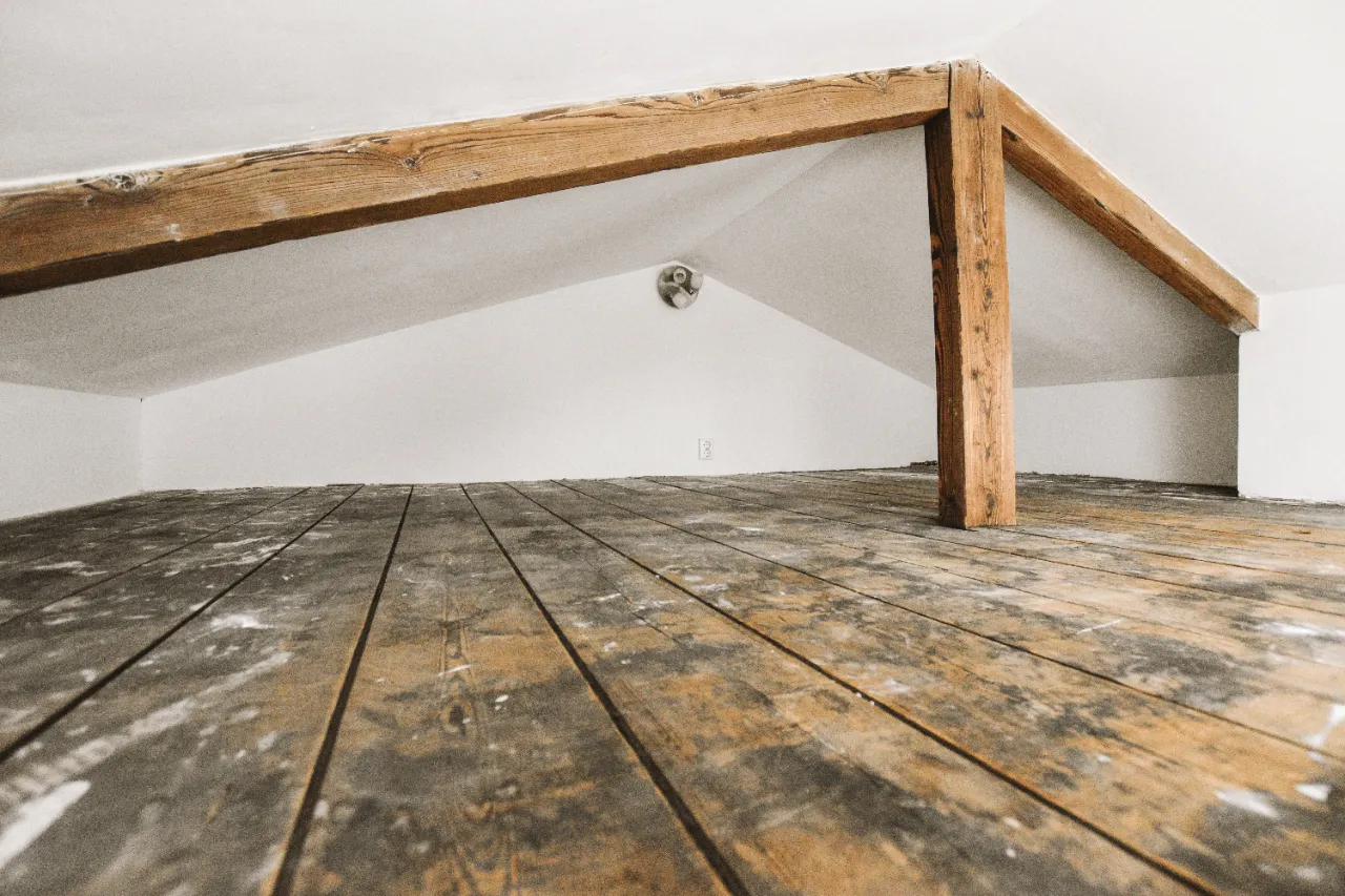 Attic decking showing water stains from a roof leak