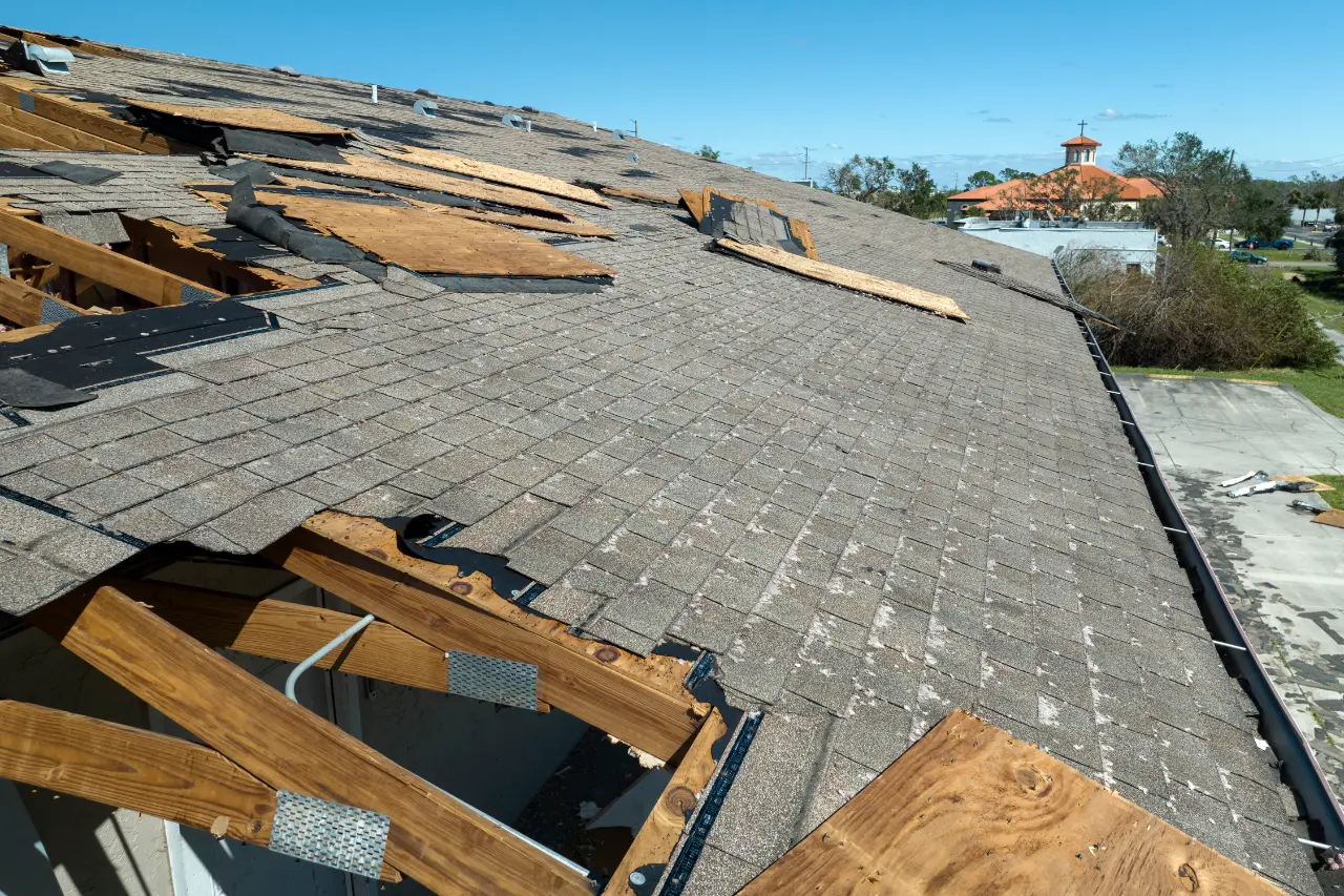 Damaged roof decking exposed during a roof replacement